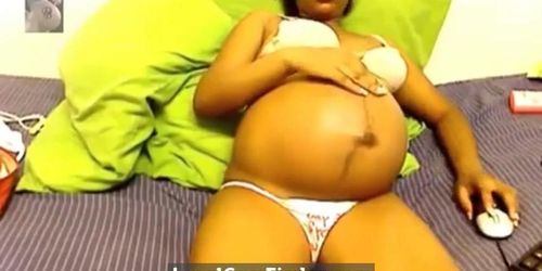 Heavily pregnant black cam chick