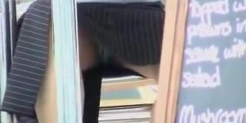 Girl with crossed legs on the under table up skirt video AA5F