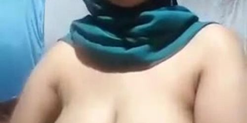 Chubby busty hijab jilbab slut with glasses showing off