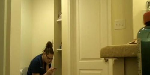 Chubby nerd girl in toilet