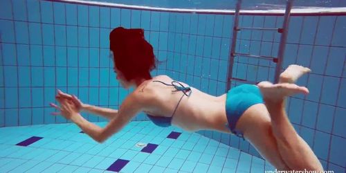 Tight blue swimsuit girl Martina in the pool