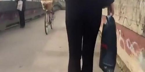 Pervert guy cums behind girl