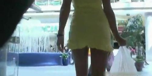 Upskirt clip with girl in sexy high heels and short yellow dress