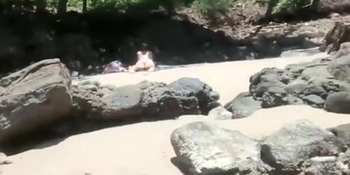 Voyeur secretly films woman in bikini sunbathing