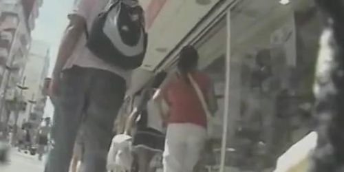 Upskirt hosts on the street by a professional voyeur and his spy camera