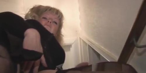 Mature busty blonde girl in stockings and mini skirt striptease