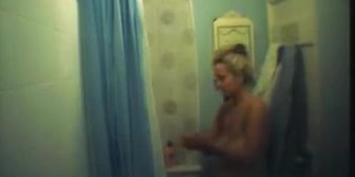 Big breasted blonde captured on a shower spy cam (peeping tom)