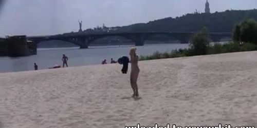 Naked teen nudist lets the water kiss her body