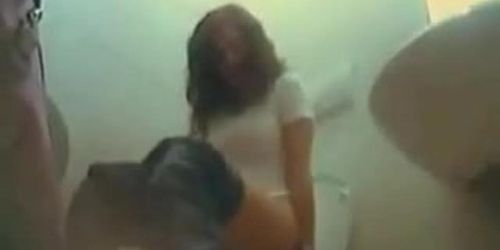 Amateur girl sitting motionless when pissing on toilet