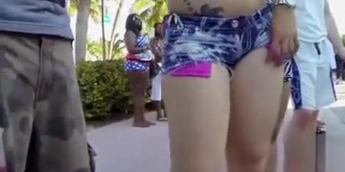 Big amateur ass hanging out of tight shorts
