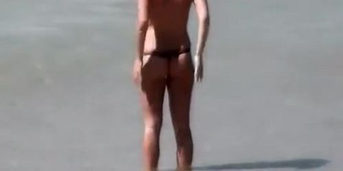 Blonde woman topless with small tits