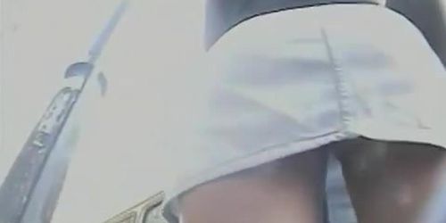 Upskirt amateur brunette with no panties on