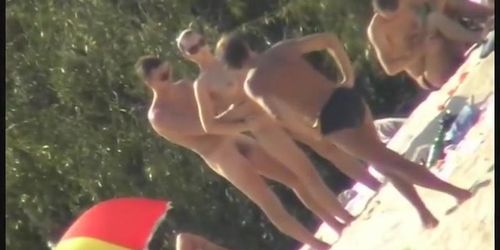 Nude spy cam on the beach with a black hair goddess in focus