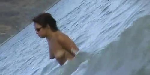 Fat ass big boobed woman is swimming at the summer beach