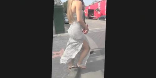 Strong wind plays with a Turkish girl's revealing dress