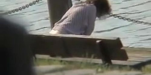 Amateur milf caught pissing on the river bank