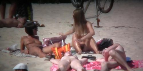 2 white babes with nice big side saggin breasts on a nude beach