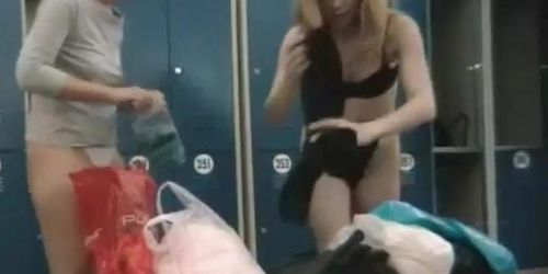 Two savoury babes getting dressed in a spy cam video