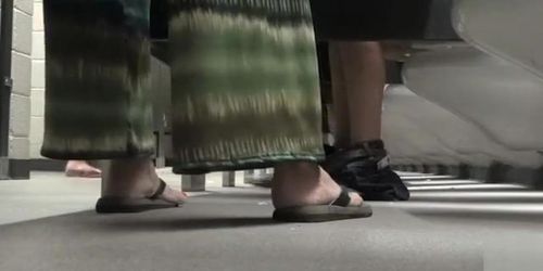 Foot fetish cam in busy public restroom