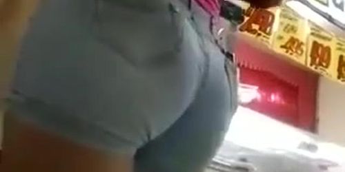 Brazilian blond of shorts in supermarket