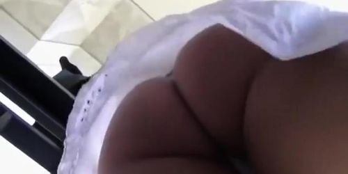 Tiny thong between firm butt cheeks