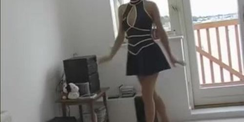 Girl in mini skirt stripping in the kitchen