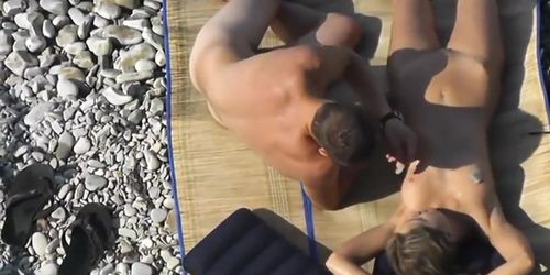 Guy Jerks dick before her gf at a public beach