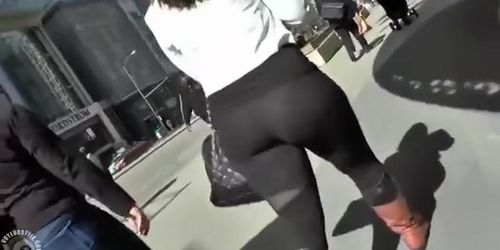 Big butt woman walks the city streets in spandex