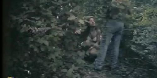 A couple hiding in vain in the woods to take a piss voyeur video