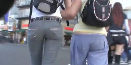 A duo of teen asses followed around the city by a voyeur cam