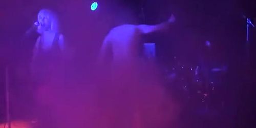 Drunken man gets naked on the rock stage