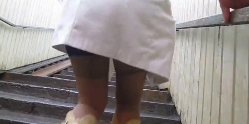 Baby flashing tan stockings tops going upstairs