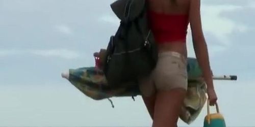 Brunette girl dressing at beach