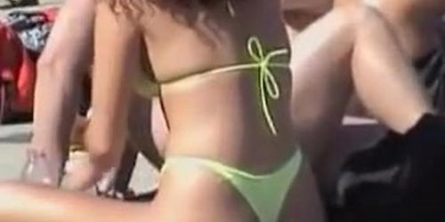Bikini girl lying stretched on the beach candid video 06u
