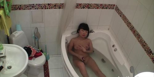 Bathtub masturbation of the breathtaking Asian girl