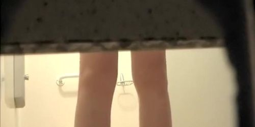 Woman showers with a luffa
