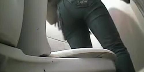 Hot woman pissing in a toilet