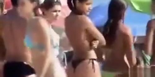 Latina girl with big booty wears a flimsy bikini bottom
