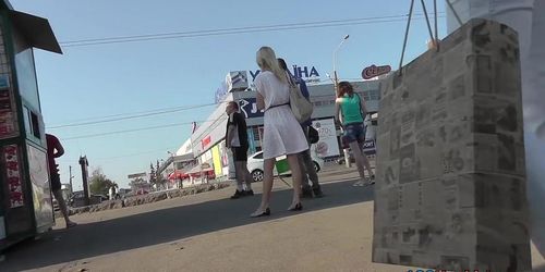 Blonde-haired girl with slender forms in upskirts video