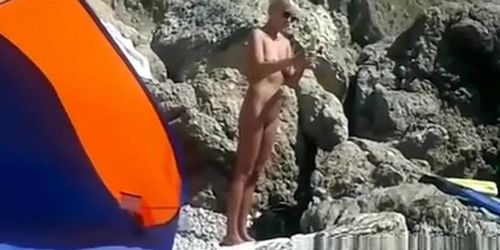 Blonde nudist woman secretly filmed at beach