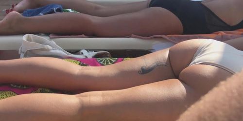 sunbathing brunette ass