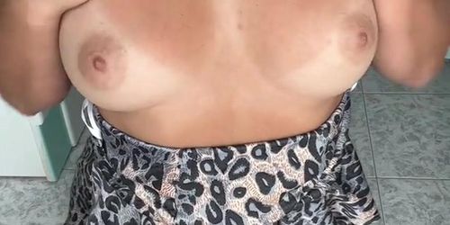 Horny wife squeezing her boobs in leopard dress