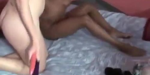 Sexy black beauty tickles redhead's clit with vibrator then licks her black clits pussy