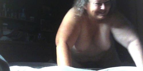 Fat Grandma C.K. climb on the bed with her tits hanging