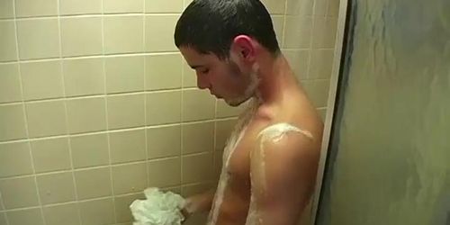 Big strong dick brunette twink wanking it rough in the shower