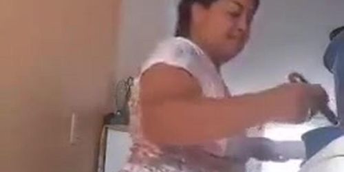 Housewife teasing while cooking for her husband