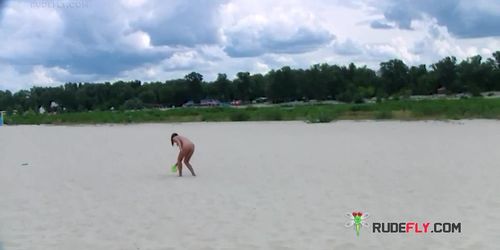 Two young nudist friends love going to the beach together