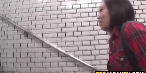 Cute asian babe pisses on subway