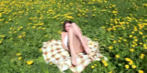 Beautiful teen Ananta Shakti masturbates her pussy on a field with dandelions porn