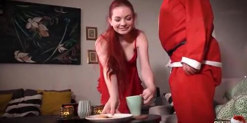 Redheaded girl enjoying Christmas fucking with Santa
